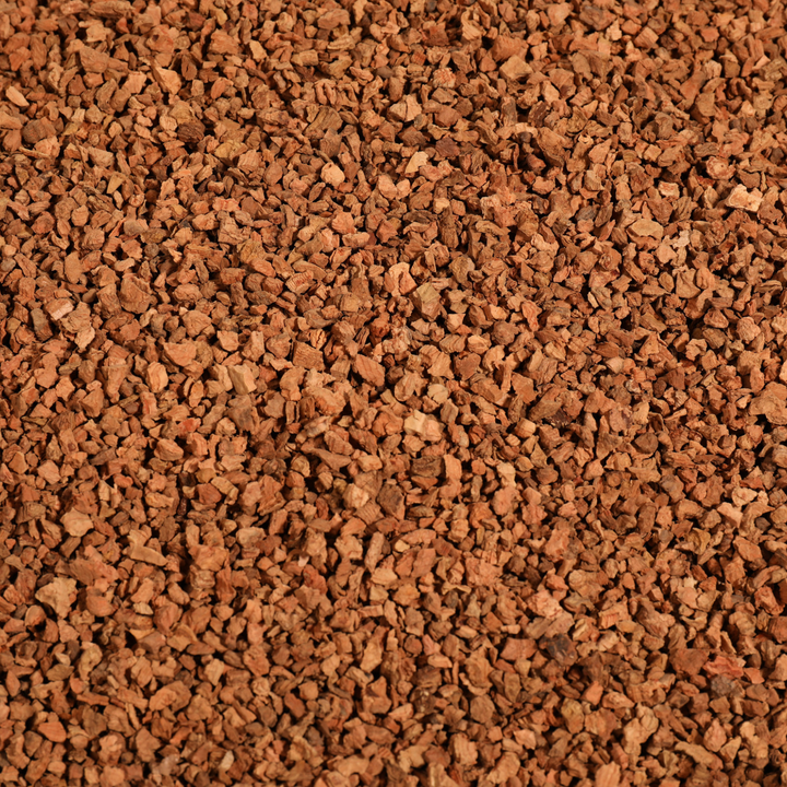 Natural cork pebbles for hamster habitat decoration and enrichment.