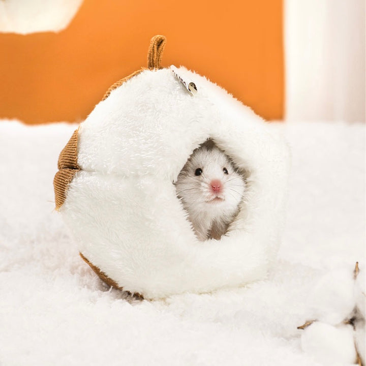 Adorable cabin-shaped hamster hideout made from soft cotton material.